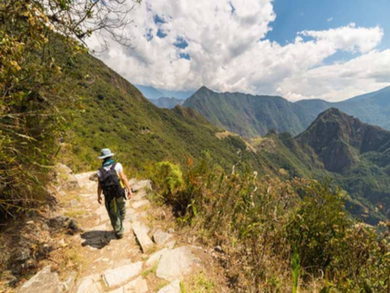 Backpacker exploring Machu Picchu trails, Peru
